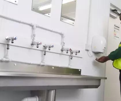 employee using portable toilet facilities