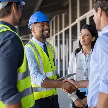 Construction team shaking hands