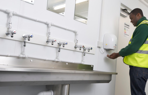 employee using portable toilet facilities