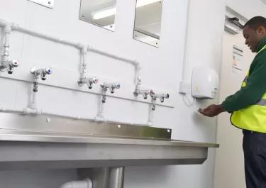 employee using portable toilet facilities